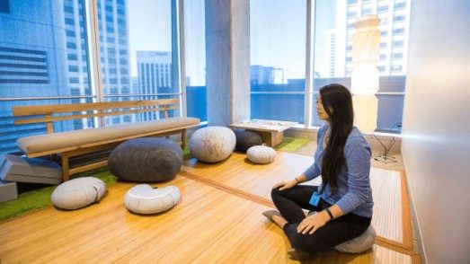 woman meditating in the office